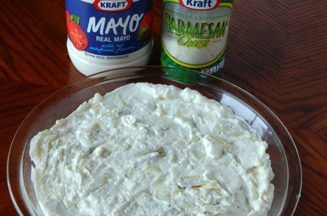 After mixing the ingredients together for the KRAFT Hot Artichoke Dip you spread them onto a pie plate and then baking.